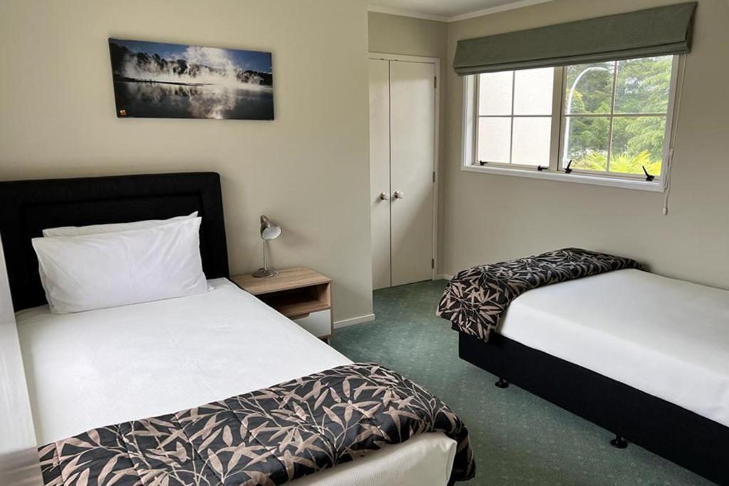Silver Fern Rotorua Suites & Spa מראה חיצוני תמונה A bedroom at the hotel